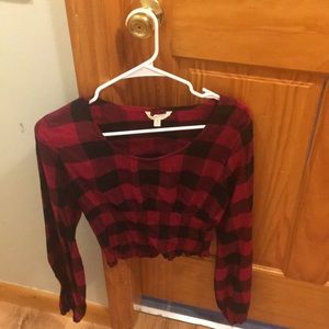 A checkered long sleeved crop top